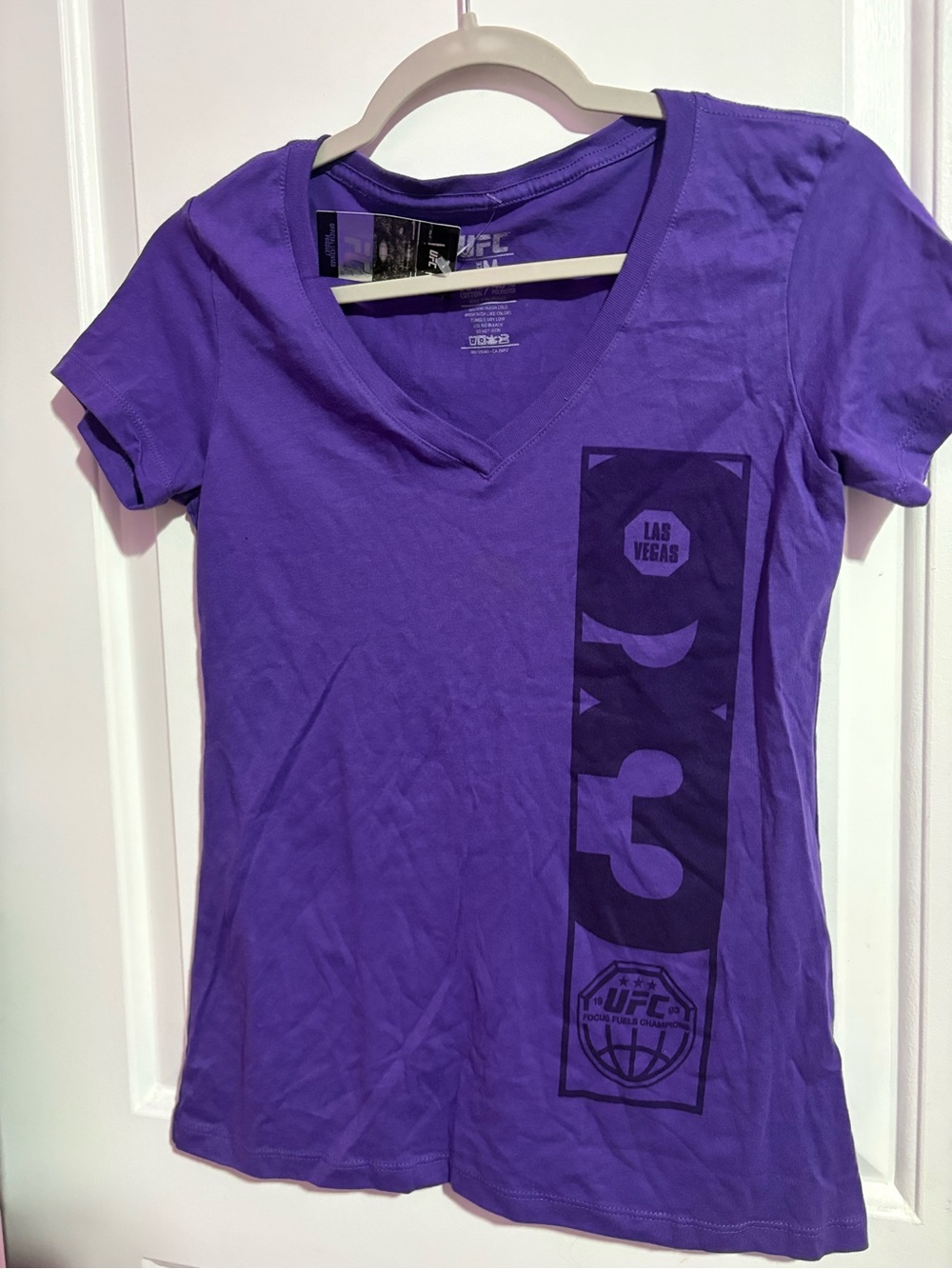 UFC Women's Purple V-Neck Tee with Las Vegas Vertical Graphic